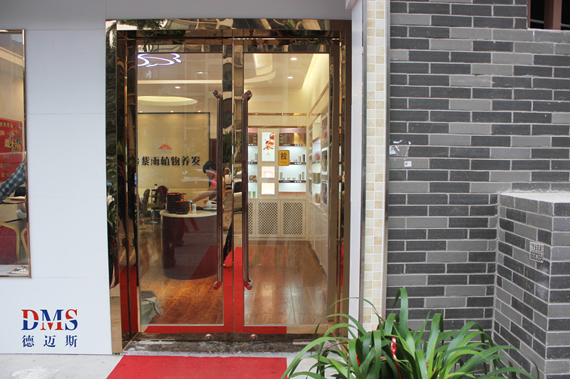 郑州金紫雨总部镜面玫瑰金地弹门